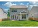The back of the property features a spacious yard and a covered porch extension at 1908 Woodsdale Dr, Durham, NC 27703
