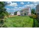 Expansive backyard showcasing the well-kept lawn and the privacy provided by wooden fencing at 1908 Woodsdale Dr, Durham, NC 27703