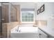 Luxurious bathroom featuring a soaking tub and a separate shower at 1908 Woodsdale Dr, Durham, NC 27703