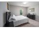 Cozy bedroom with neutral walls, comfortable carpet, and a lovely window view at 1908 Woodsdale Dr, Durham, NC 27703