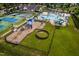 Aerial view showcasing the community pool, clubhouse, pickleball, and playground amenities at 1908 Woodsdale Dr, Durham, NC 27703