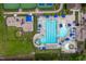 Overhead shot of community pool and play area, featuring lounge chairs, umbrellas and manicured green space at 1908 Woodsdale Dr, Durham, NC 27703