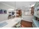 Dining area featuring stylish furnishings adjacent to a modern kitchen at 1908 Woodsdale Dr, Durham, NC 27703