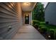 Inviting front porch with a charming front door and neat landscaping at 1908 Woodsdale Dr, Durham, NC 27703