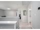 Upstairs hallway with neutral walls that provide access to several rooms and bathrooms at 1908 Woodsdale Dr, Durham, NC 27703