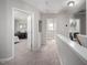 Upstairs hallway with access to bedroom and laundry room with great natural light at 1908 Woodsdale Dr, Durham, NC 27703