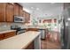 Well-equipped kitchen with stainless appliances and a view of the dining area at 1908 Woodsdale Dr, Durham, NC 27703