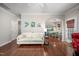 Cozy living room with hardwood floors, white sofa, and decorative wall art at 1908 Woodsdale Dr, Durham, NC 27703