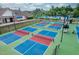 A high angle view of the community's new pickleball courts with a building in the background at 1908 Woodsdale Dr, Durham, NC 27703