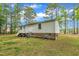 The home features white siding, with a staircase that leads into the green backyard at 196 Marlin Ln, Smithfield, NC 27577