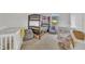 Bedroom with bunkbeds, cribs, and natural light from a window at 196 Marlin Ln, Smithfield, NC 27577