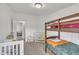 Bedroom featuring bunk beds, a crib, and neutral carpeting at 196 Marlin Ln, Smithfield, NC 27577