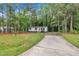 Charming single-story home featuring white siding, black shutters, and a welcoming red front door at 196 Marlin Ln, Smithfield, NC 27577