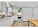 Updated kitchen with white cabinets, granite counters, modern appliances, and stylish flooring at 196 Marlin Ln, Smithfield, NC 27577