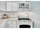 Bright kitchen featuring white appliances, subway tile backsplash, and plenty of cabinet space at 196 Marlin Ln, Smithfield, NC 27577