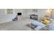 Another angle of a living room featuring neutral carpet, gray walls, a piano, and contemporary furniture at 196 Marlin Ln, Smithfield, NC 27577