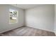 This bedroom features a large window that offers natural light and pleasant outdoor views at 203 Benton Dr, Oxford, NC 27565