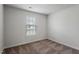 Bright bedroom with a large window and plush carpeting provides a comfortable and inviting space at 203 Benton Dr, Oxford, NC 27565