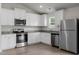 Modern kitchen with stainless steel appliances, granite countertops, and white cabinets providing lots of storage at 203 Benton Dr, Oxford, NC 27565