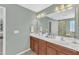 Large bathroom with a double sink, vanity, and a large framed mirror at 205 Forbes Rd, Wake Forest, NC 27587