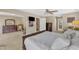 Large bedroom offering a TV, chair, and glimpses to other rooms via entryways at 205 Forbes Rd, Wake Forest, NC 27587