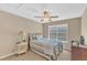 Comfortable bedroom featuring a ceiling fan and a window for natural light at 205 Forbes Rd, Wake Forest, NC 27587