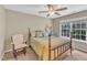 Cozy bedroom with ceiling fan, neutral color, and large windows at 205 Forbes Rd, Wake Forest, NC 27587