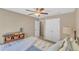 Bedroom with neutral walls, ceiling fan, and a glimpse into a second room at 205 Forbes Rd, Wake Forest, NC 27587