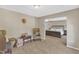 Spacious room with sitting area and a partial view of an adjacent bedroom at 205 Forbes Rd, Wake Forest, NC 27587