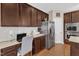 Kitchen featuring built-in desk space, stainless steel refrigerator and double oven at 205 Forbes Rd, Wake Forest, NC 27587