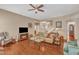 Comfortable living room with hardwood floors, a TV, and an open layout to the entryway at 205 Forbes Rd, Wake Forest, NC 27587