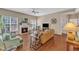Inviting living area with a fireplace, hardwood floors, and plenty of natural light at 205 Forbes Rd, Wake Forest, NC 27587