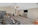 Living room features a ceiling fan and carpet flooring at 205 Forbes Rd, Wake Forest, NC 27587