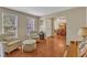 Comfortable living room with hardwood floors, neutral walls, plush seating, and abundant natural light at 205 Forbes Rd, Wake Forest, NC 27587