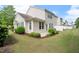 Well-maintained backyard with a patio and well manicured lawn at 207 Bell Tower Way, Morrisville, NC 27560