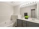 Bright bathroom features dual sinks, soaking tub, and large mirror at 207 Bell Tower Way, Morrisville, NC 27560