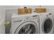 Convenient laundry room with modern washer and dryer units at 207 Bell Tower Way, Morrisville, NC 27560