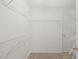 Walk-in closet with built-in shelving and carpet at 207 Bell Tower Way, Morrisville, NC 27560