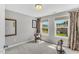 A cozy bedroom with neutral walls and two bright windows at 208 Gillean Ln, Holly Springs, NC 27540