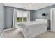 Bedroom with a double bed with storage and a large window at 208 Gillean Ln, Holly Springs, NC 27540