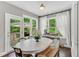 Sun-filled breakfast nook with patio access and backyard views at 208 Gillean Ln, Holly Springs, NC 27540