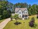 Beautiful two-story home with a well-manicured lawn and charming curb appeal at 208 Gillean Ln, Holly Springs, NC 27540