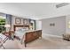 Spacious main bedroom featuring a wooden bed frame and neutral decor at 208 Gillean Ln, Holly Springs, NC 27540