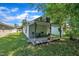 Spacious backyard with a covered patio, perfect for outdoor relaxation and entertaining at 215 N 4Th St, Smithfield, NC 27577