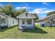 Charming single story home featuring a cozy porch and well-maintained lawn at 215 N 4Th St, Smithfield, NC 27577