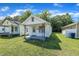 Cozy home with a covered front porch, green grass and shade trees at 215 N 4Th St, Smithfield, NC 27577