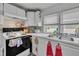 Kitchen showcasing white cabinets, laminate countertop and stainless sink at 215 N 4Th St, Smithfield, NC 27577