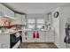 Bright kitchen featuring white cabinets, double sink, and window for natural light at 215 N 4Th St, Smithfield, NC 27577