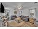 Living area showcases wood floors, an area rug and a ceiling fan at 215 N 4Th St, Smithfield, NC 27577