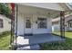 A close-up of the home's entry, featuring charming decorative iron porch posts at 215 N 4Th St, Smithfield, NC 27577